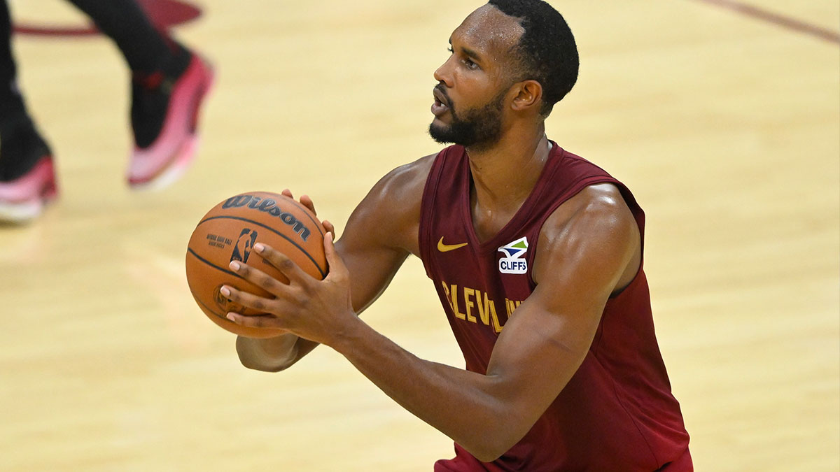 Cleveland Cavaliers forward Evan Mobley (4) shoots a three-point basket in the fourth quarter against the Washington Wizards at Rocket Arena.