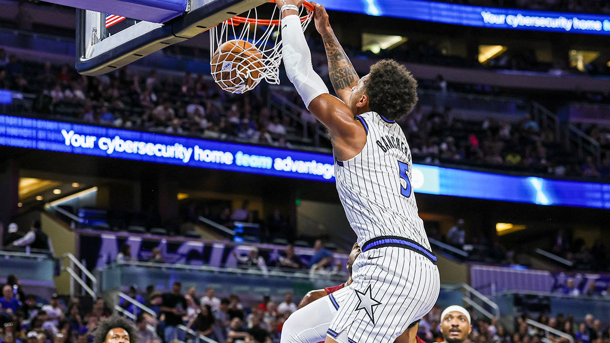 Orlando Magic forward Paolo Banchero (5) dunks during the first quarter against the Cleveland Cavaliers at Kia Center.