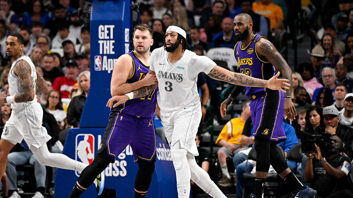 Los Angeles Lakers guard Luka Doncic (77) and forward LeBron James (23) and Dallas Mavericks forward Anthony Davis (3) in action during the game between the Dallas Mavericks and the Los Angeles Lakers at American Airlines Center.