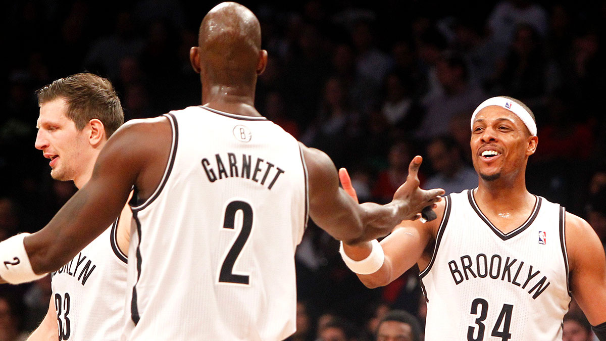 Brooklyn Nets forward Kevin Garnett (2) reacts with Brooklyn Nets forward Paul Pierce (34) in the fourth quarter against Philadelphia 76ers at Barclays Center. Nets won 108-102.