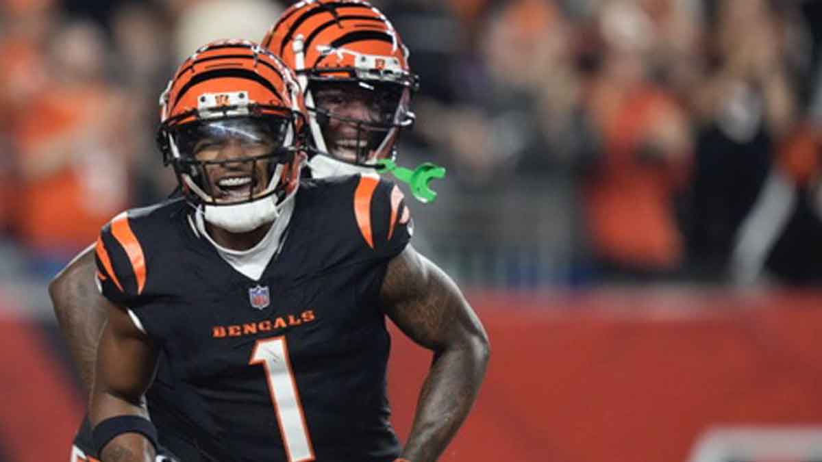 Cincinnati Bengals wide receiver Ja'Marr Chase (1) and wide receiver Tee Higgins (5) celebrate a Chase touchdown in the first quarter of the NFL Week 3 game between the Cincinnati Bengals and the Washington Commanders at Paycor Stadium in downtown Cincinnati on Monday, Sept. 23, 2024.