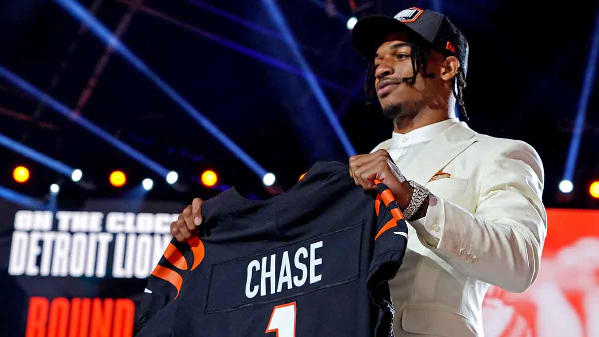 Ja'Marr Chase (LSU) poses with a jersey after being selected by Cincinnati Bengals as the number five overall pick in the first round of the 2021 NFL Draft at First Energy Stadium.