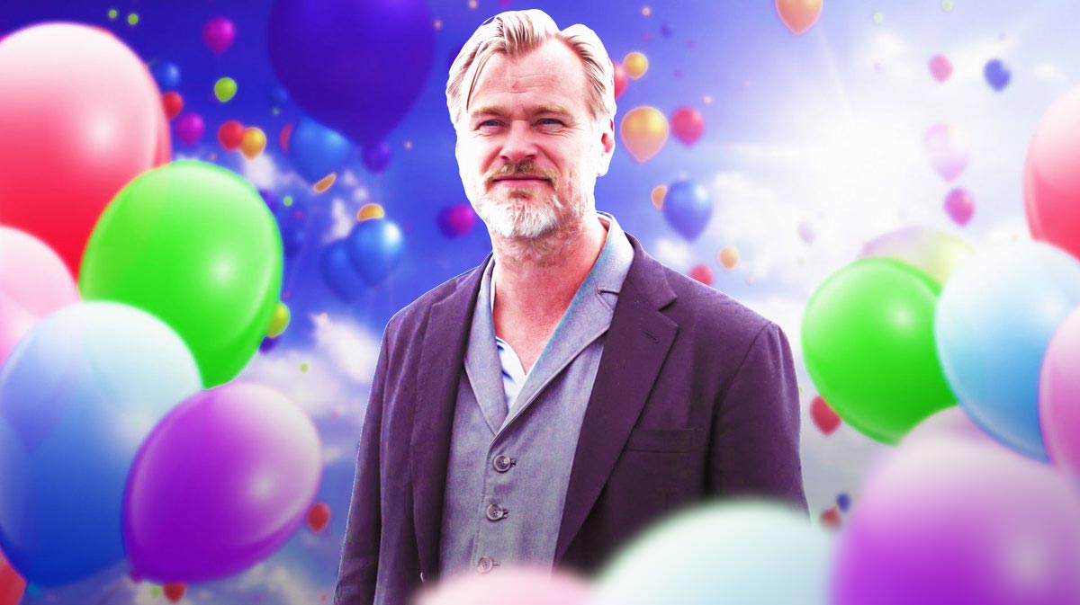 Christopher Nolan surrounded by balloons.