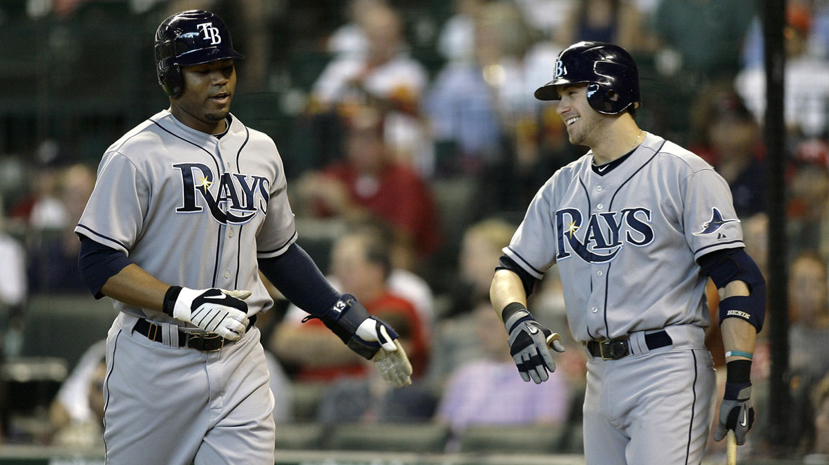 Tampa Bay Rays left fielder Carl Crawford (13) is congratulated by third baseman Evan Longoria (3) after scoring a run against the Houston Astros in the first inning at Minute Maid Park.