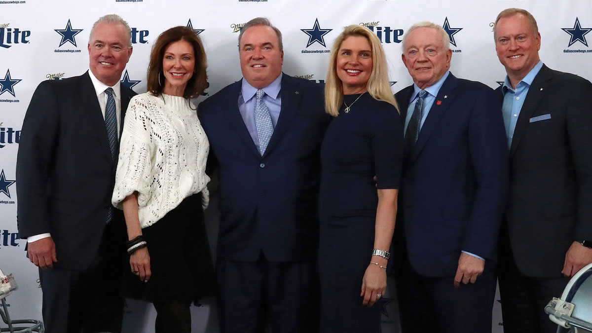 Dallas Cowboys head coach Mike McCarthy (center) poses for a photo with (from left) Stephen Jones , Charlotte Jones , wife Jessica Kress , Jerry Jones and Jerry Jones Jr. after a press conference at Ford Center at the Star.