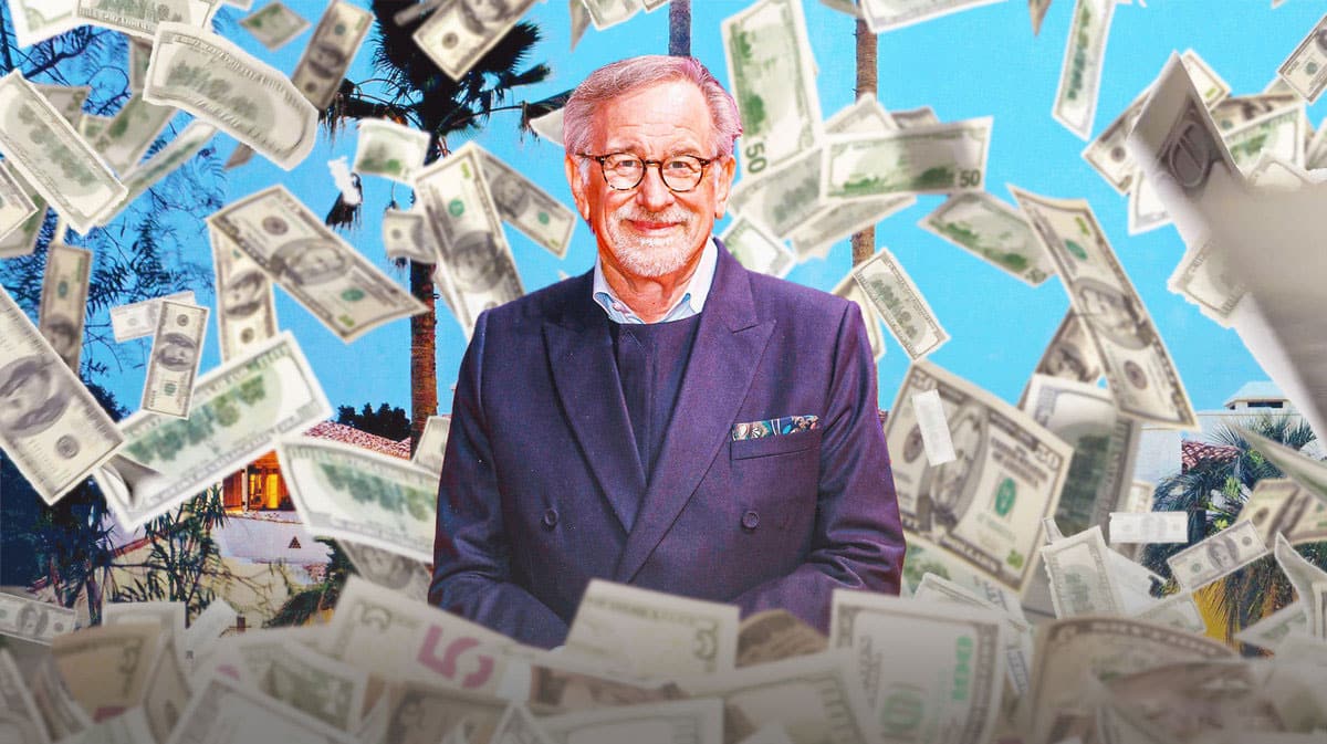 Steven Spielberg surrounded by piles of cash.