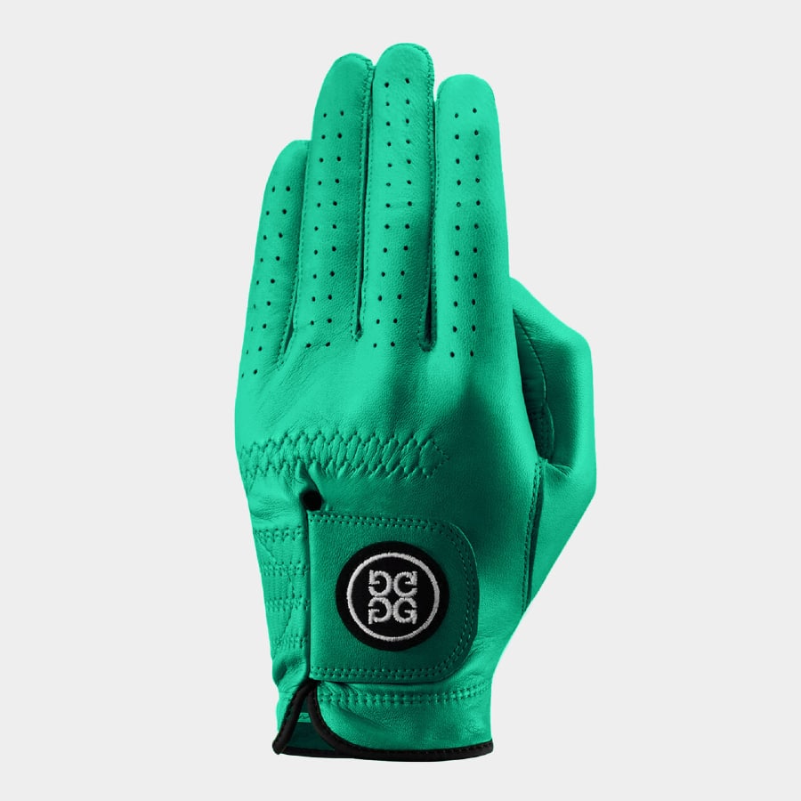 Clover green G Fore golf glove on a light grey background.