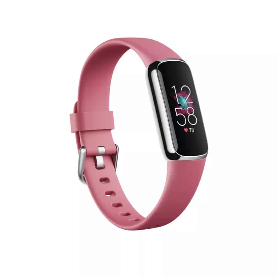 Fitbit luxe tracker with a pink band on a white background.