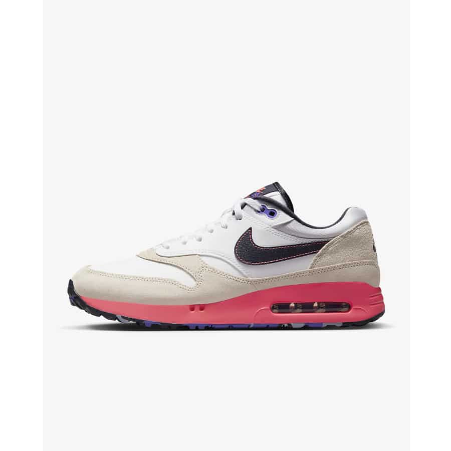Nike Air Max 1 '86 OG G NRG in a white and hot punch colorway on a grey background.