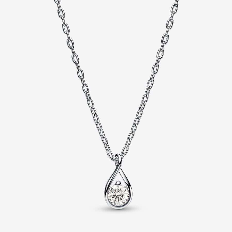 A Pandora - Brilliance lab-created 0.25ct. tw diamond pendant & necklace on a grey background.