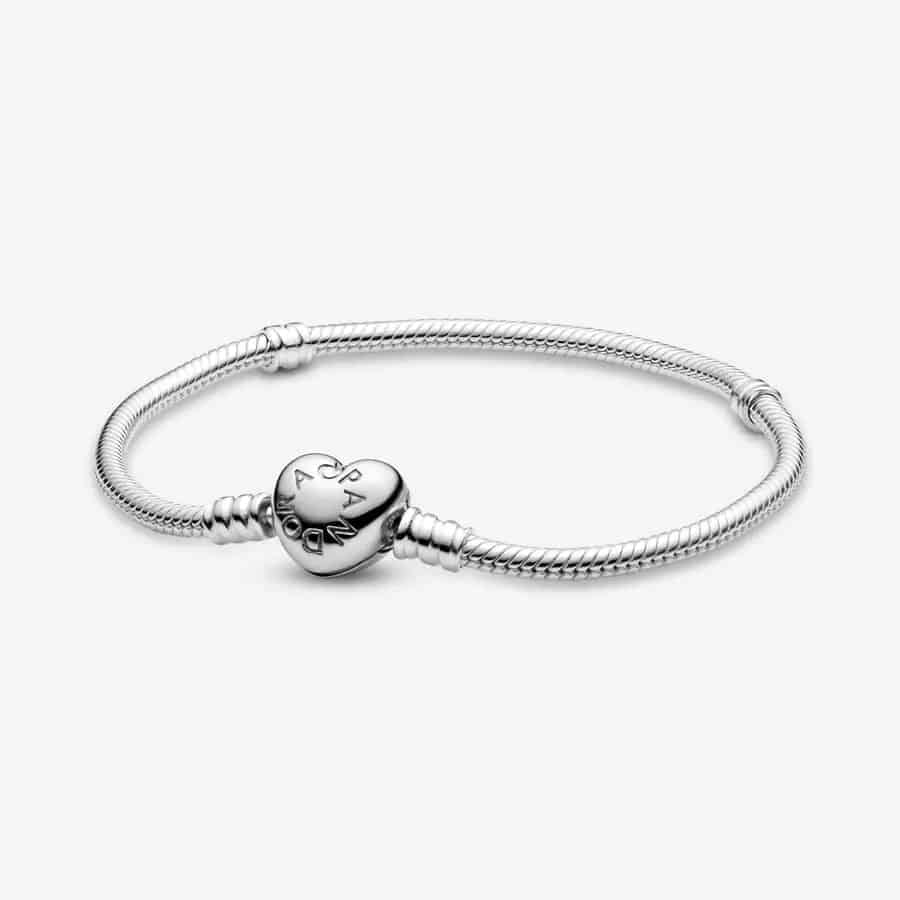 Pandora Moments Heart Clasp Snake Chain Bracelet on a grey background.