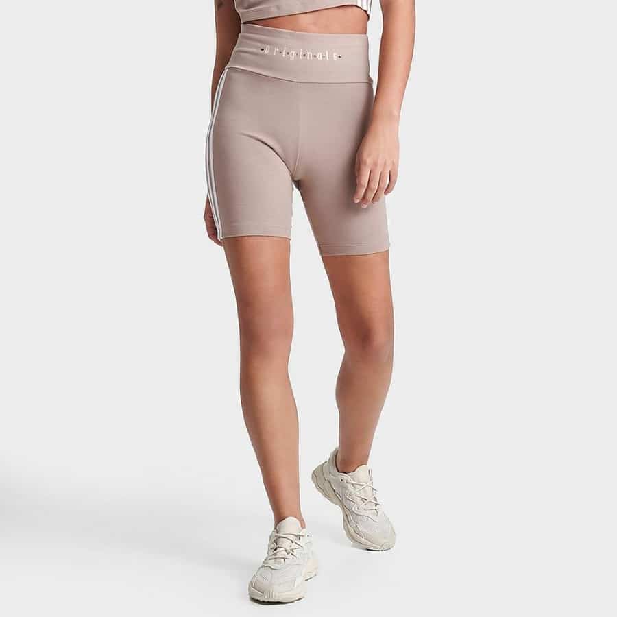 Adidas Originals women's Adicolor essentials bike short leggings - Chalky brown colorway on a grey background.