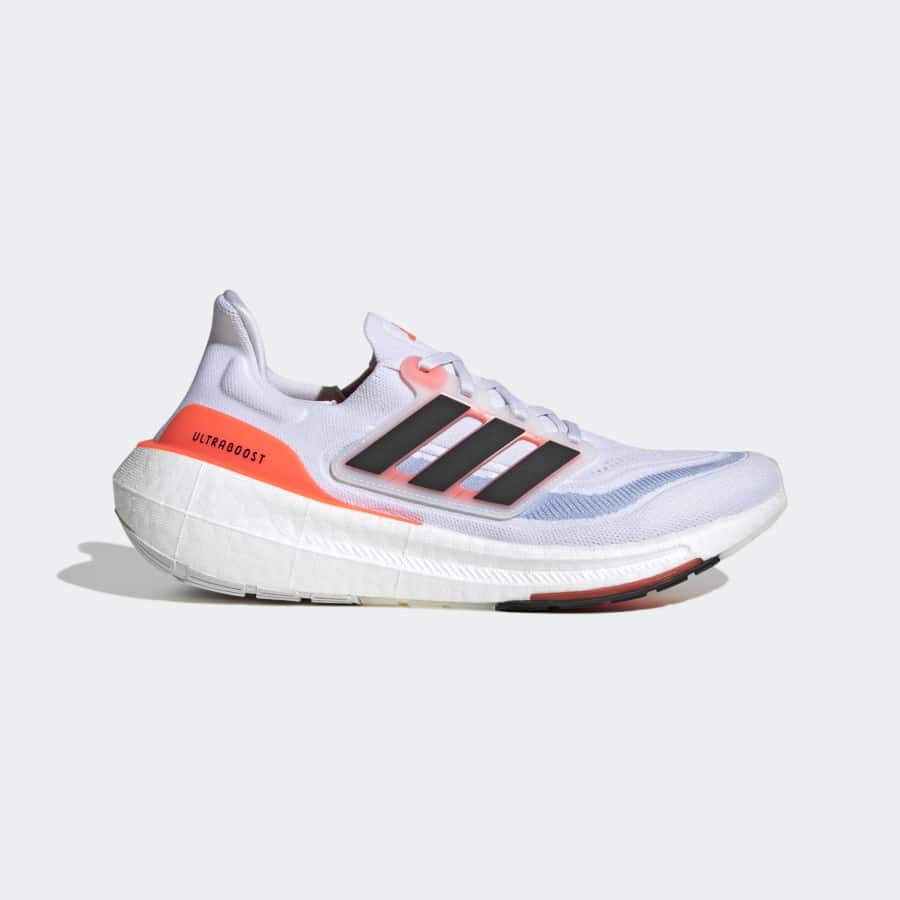 Adidas Ultraboost Light - Cloud white Core black Solar red colorway running shoe on a light gray background.