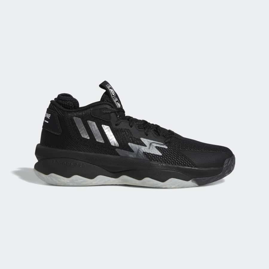 Adidas Dame 8 basketball shoes - Black colored on a light gray background.
