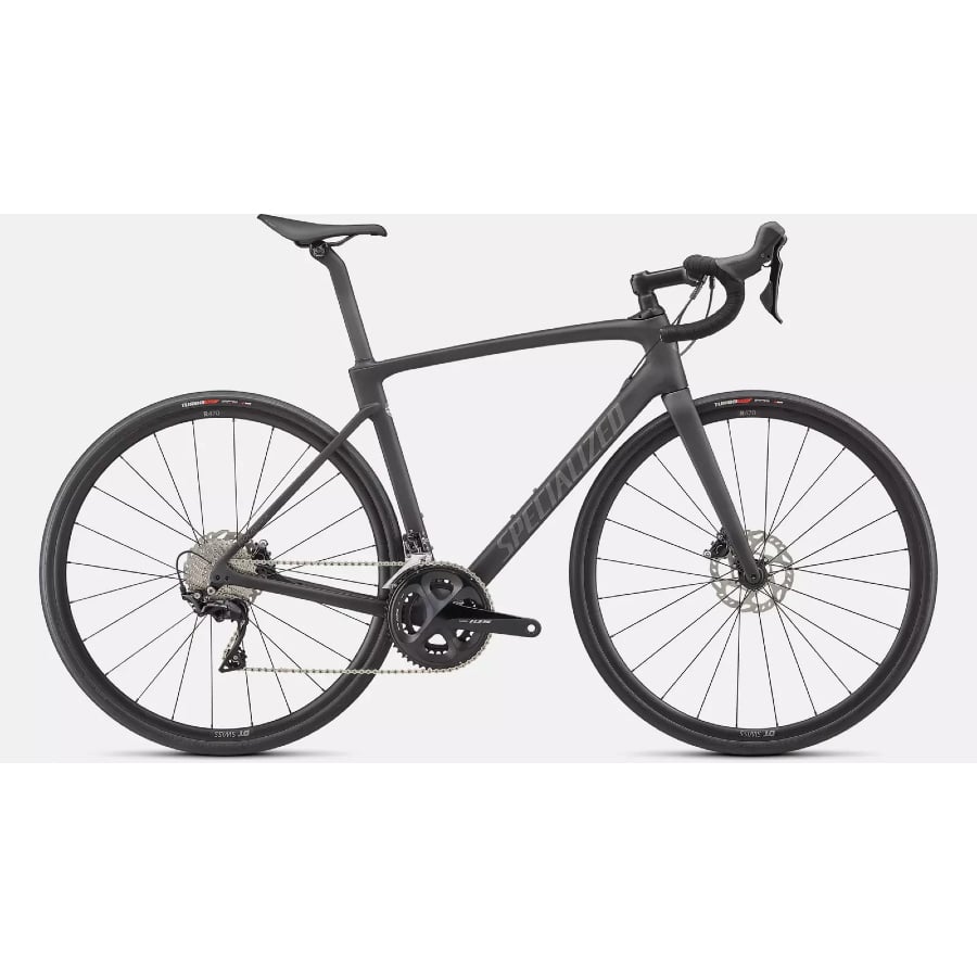 Specialized Roubaix Sport road bike - Smoke/Silver Dust/Black colorway on a light grey background.