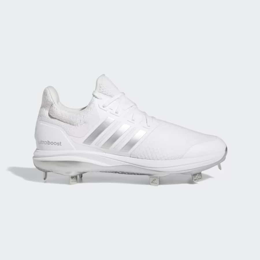 Adidas Ultraboost DNA 5.0 Cleats - Cloud white/Silver metallic colorway on a light gray background. 