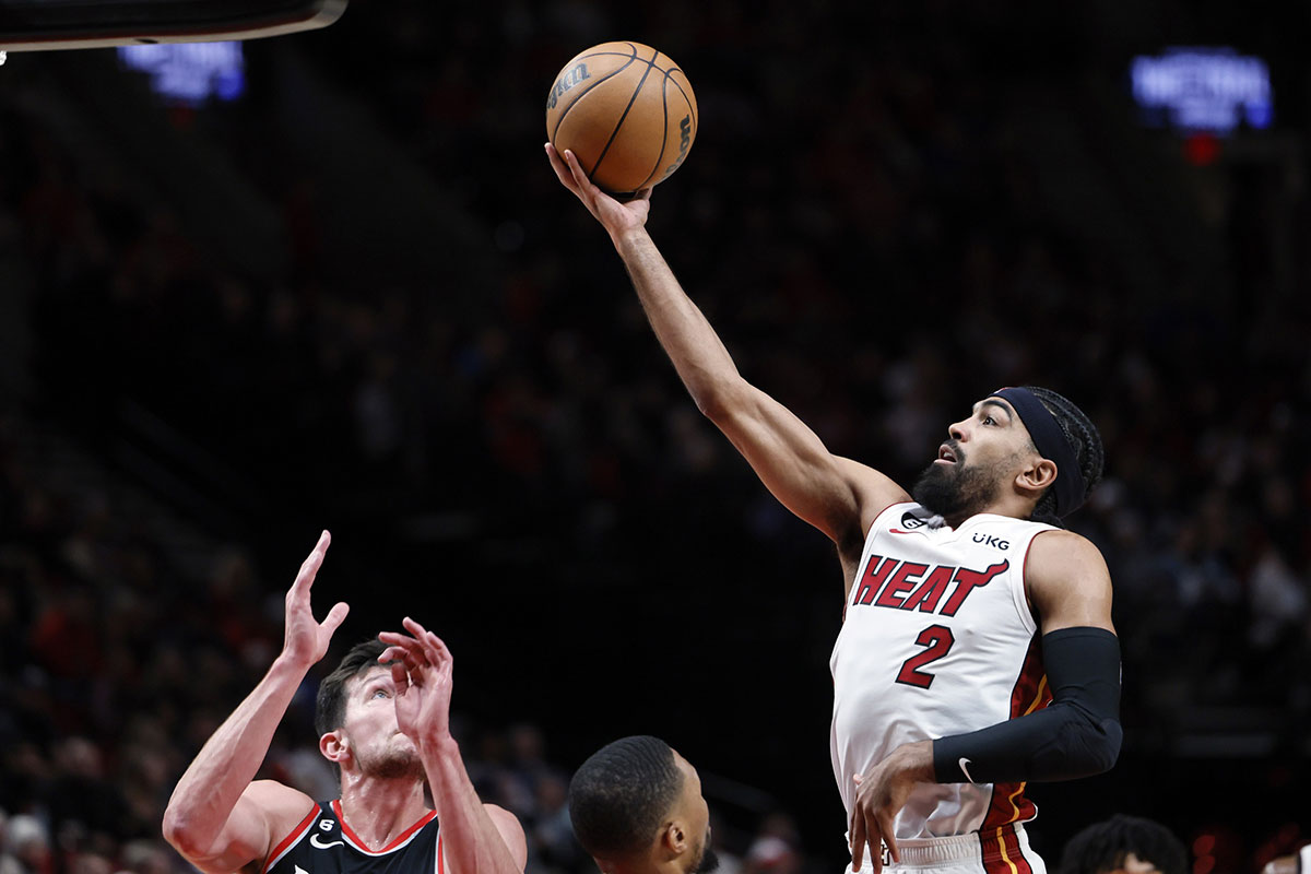 Miami Heat point guard Gabe Vincent (2) shoots under pressure from Portland Trail Blazers power forward Drew Eubanks (24) during the first half at Moda Center.