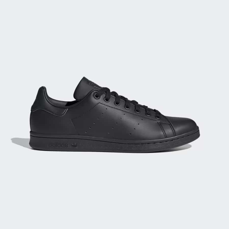 Adidas Stan Smith Shoes - Core Black/Core Black/Cloud White colorway on a light gray background.