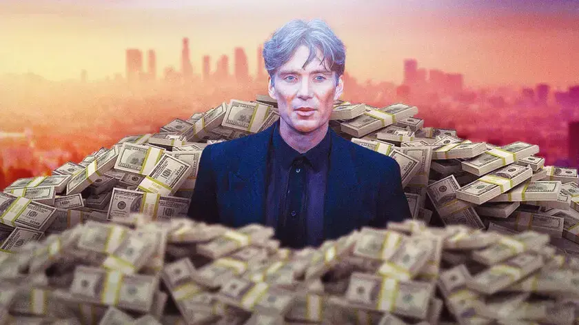 Cillian Murphy surrounded by piles of cash.