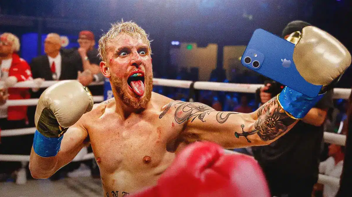Jake Paul taking a video of himself while boxing.