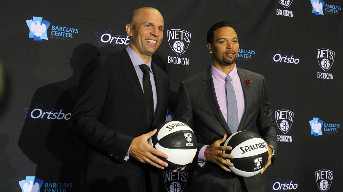 Brooklyn Nets head coach Jason Kidd poses for photos with guard Deron Williams during a press conference at Barclays Center.