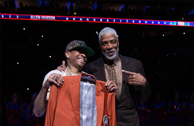 Philadelphia 76ers great Allen Iverson is presented a jacket by Julius Dr. J Erving during a ceremony for his induction to the hall of fame during halftime against the Los Angeles Lakers at Wells Fargo Center.