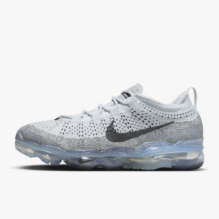 Nike Air VaporMax 2023 Flyknit - Pure Platinum/Anthracite/Pure Platinum/White on a light gray background. 