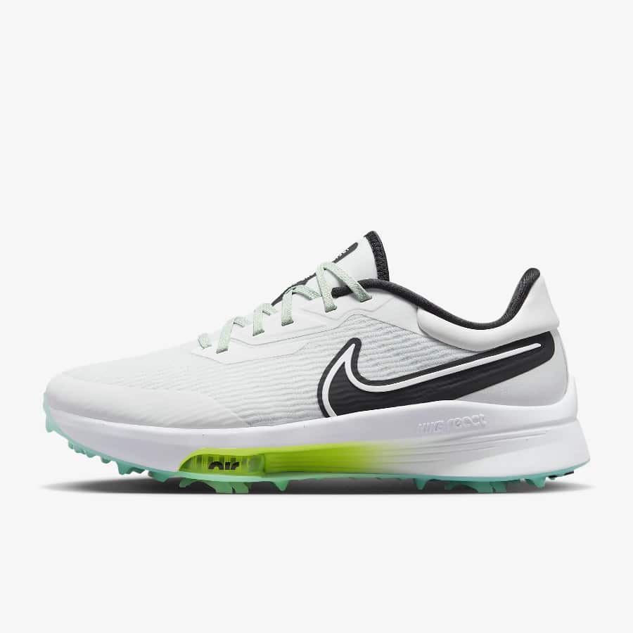 Nike Air Zoom Infinity Tour NEXT% - Photon Dust/Volt/Emerald Rise/Black colorway on a light gray background. 