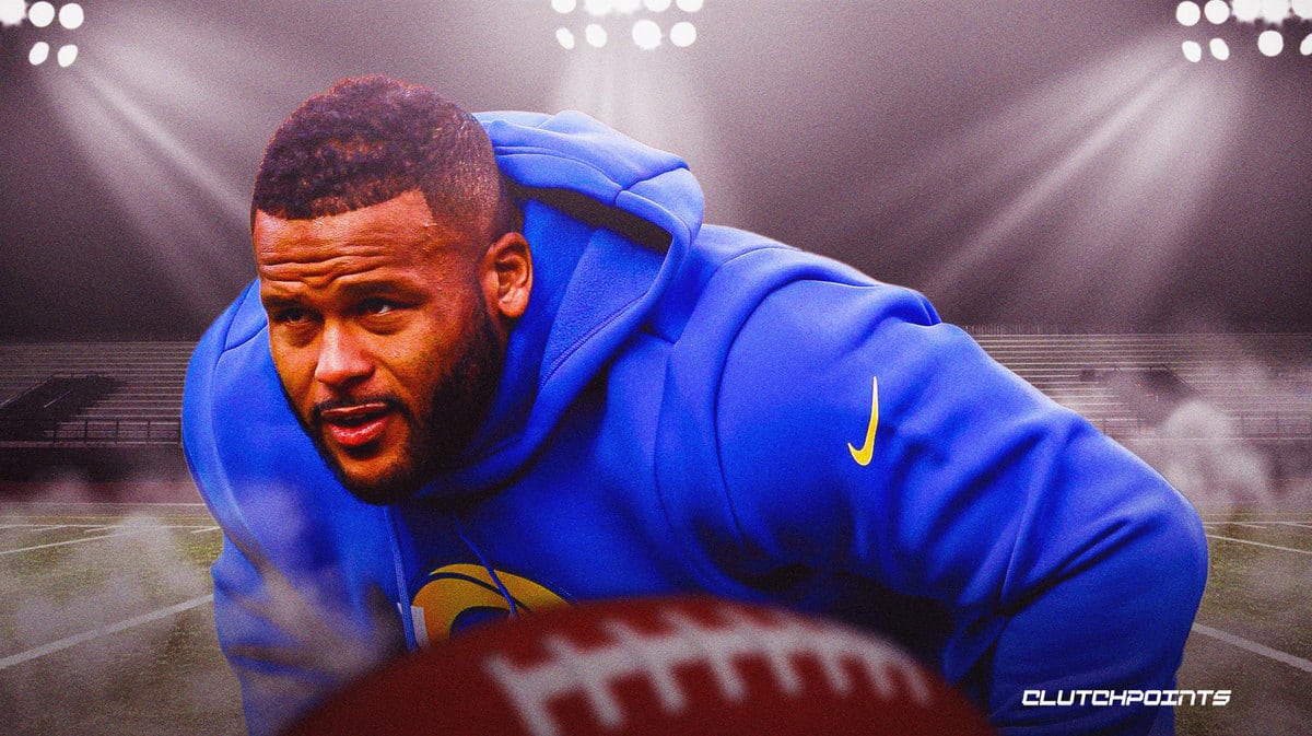 Los Angeles Rams defensive tackle Aaron Donald smiles on the sideline  before a preseason NFL football game against the Los Angeles Chargers  Saturday, Aug. 12, 2023, in Inglewood, Calif. (AP Photo/Ryan Sun