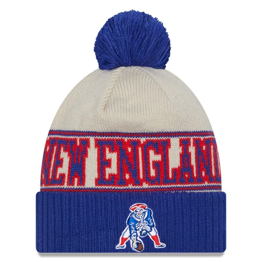 New England Patriots New Era 2023 Sideline Historic Pom Cuffed Knit Hat - Cream/Blue colorway on a white background.