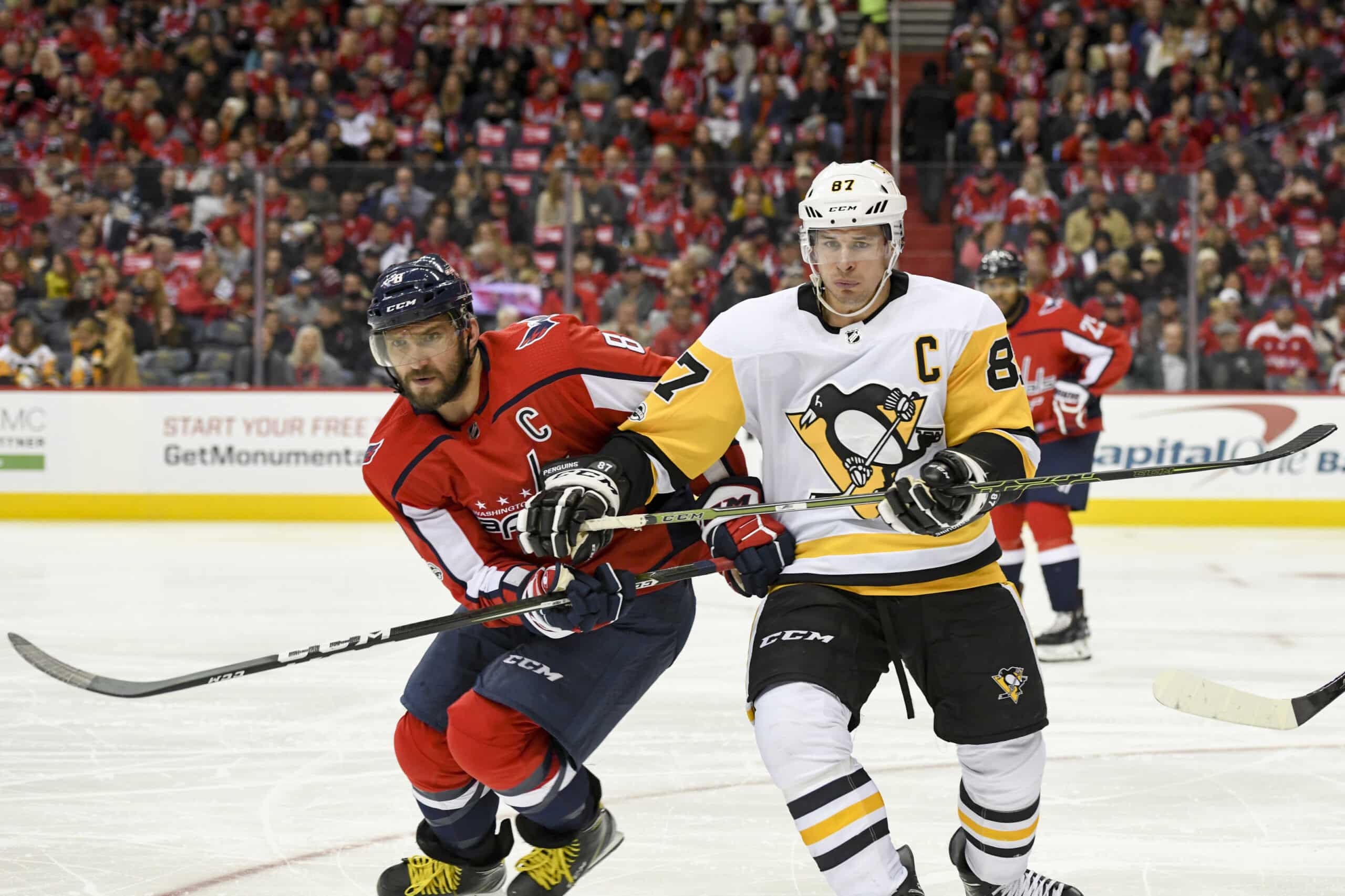 Washington Capitals left wing Alex Ovechkin (8) and Pittsburgh Penguins center Sidney Crosby (87) fight for a second period puck on November 10, 2017, at the Capital One Arena in Washington, D.C. 