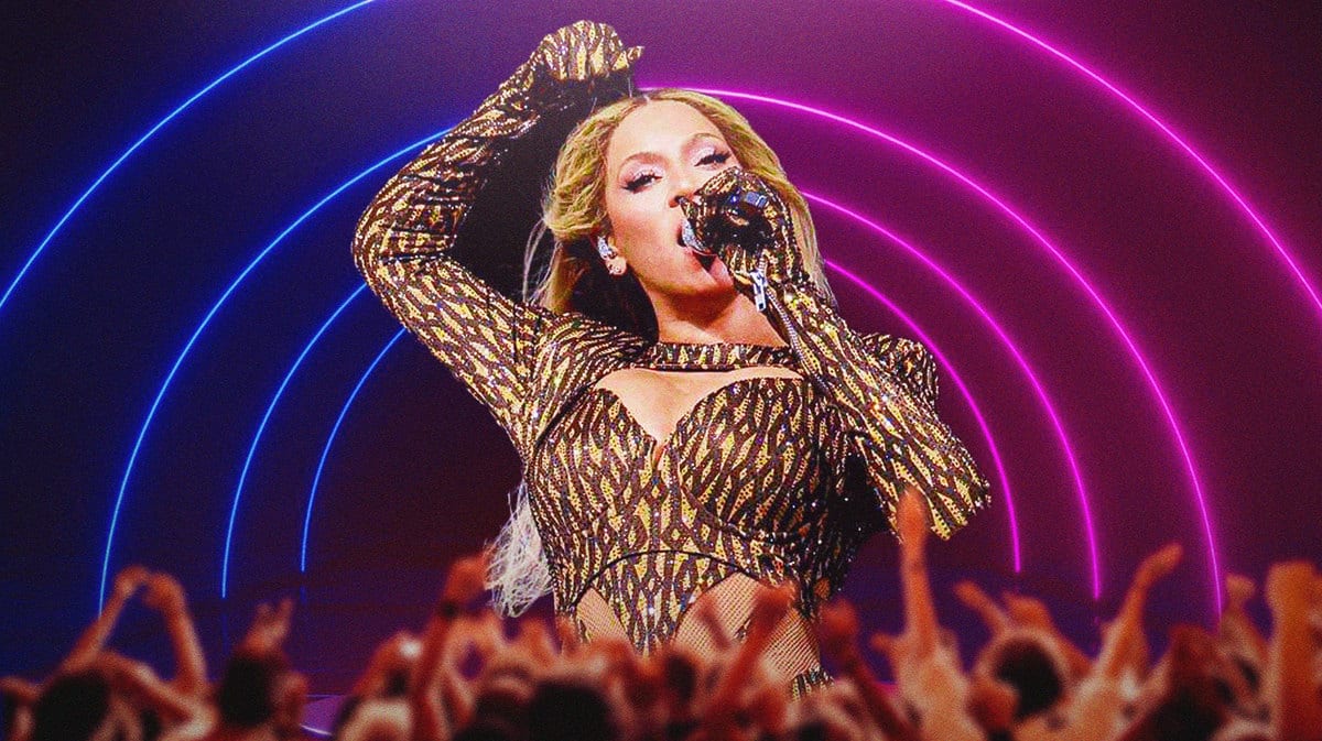 Beyoncé performing on stage in front of a crowd.