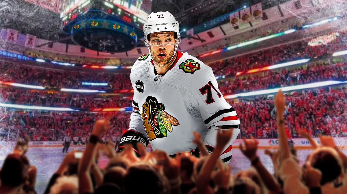 Chicago Blackhawks forward Taylor Hall with the United Center in the background.