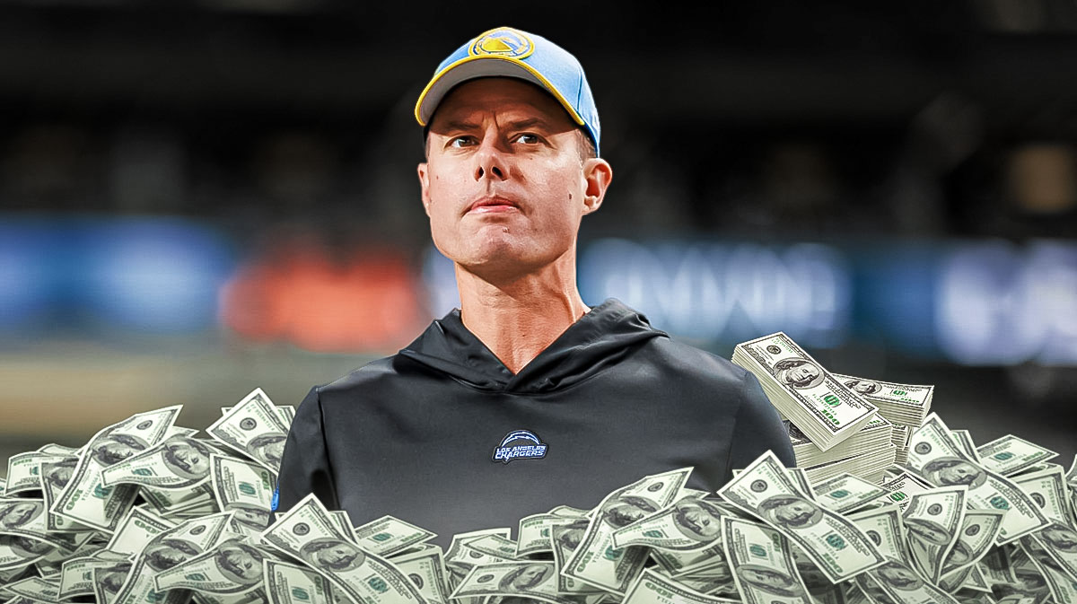 Brandon Staley surrounded by piles of cash.