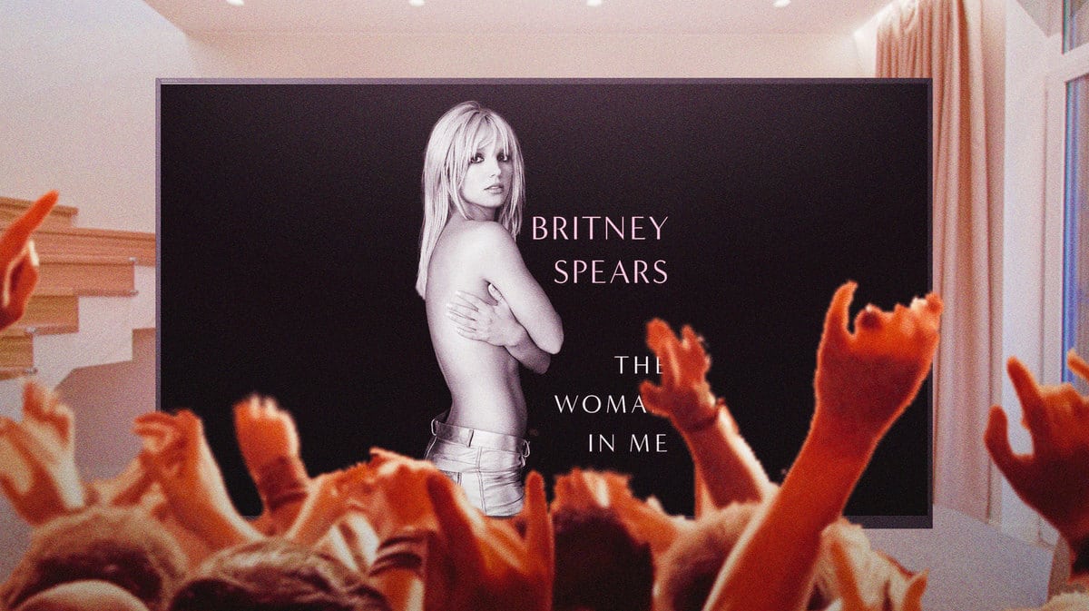 Britney Spears The Woman In Me book cover on a television with fans watching her.