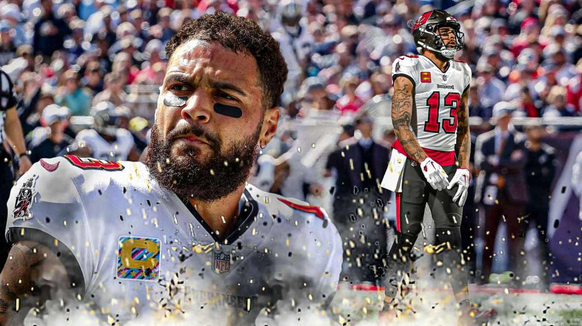 Mike Evans in the foreground with Buccaneers playing behind him.