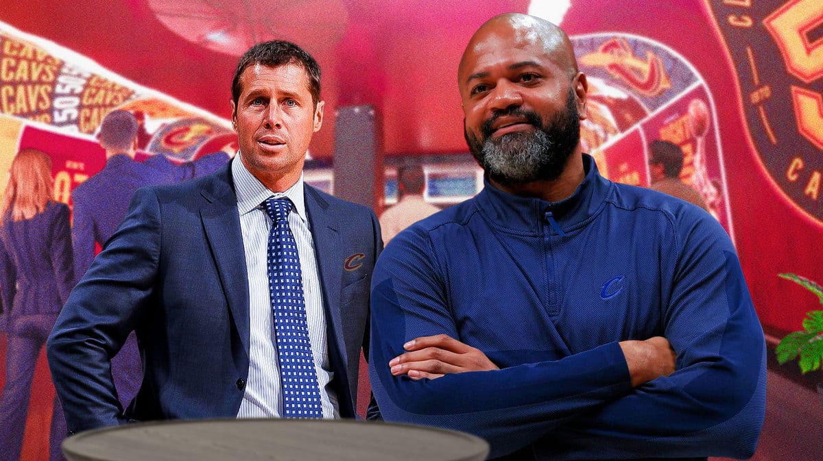 Dave Joerger wearing Cavs gear. JB Bickerstaff smiling