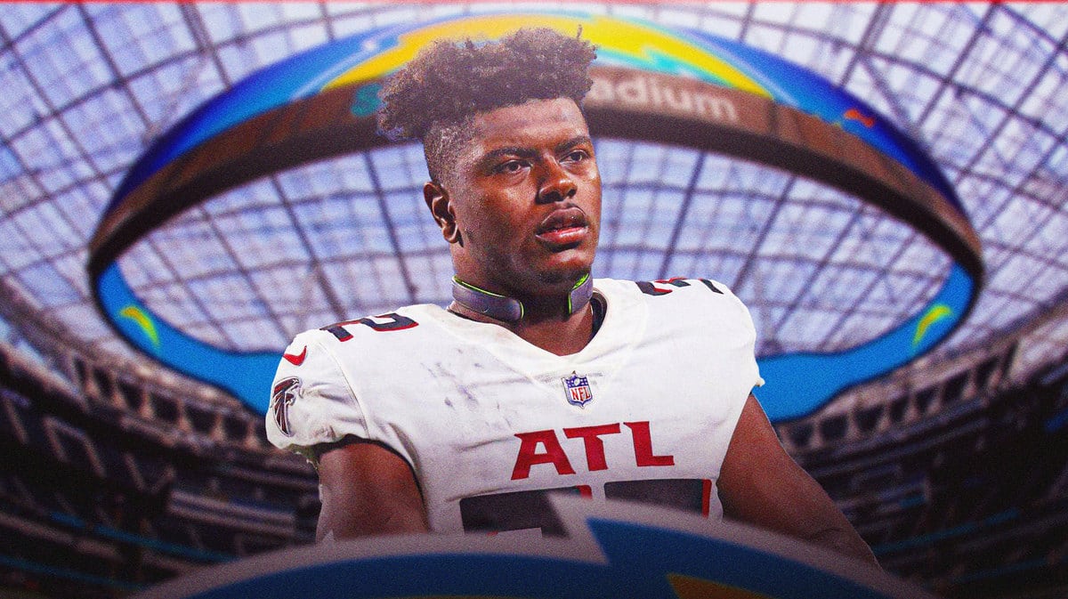 Chargers Jaylinn Hawkins in front of stadium