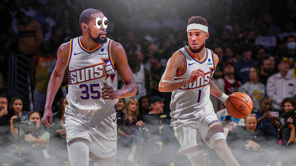 Action shot of Devin Booker with Kevin Durant looking at Booker with eyes emoji