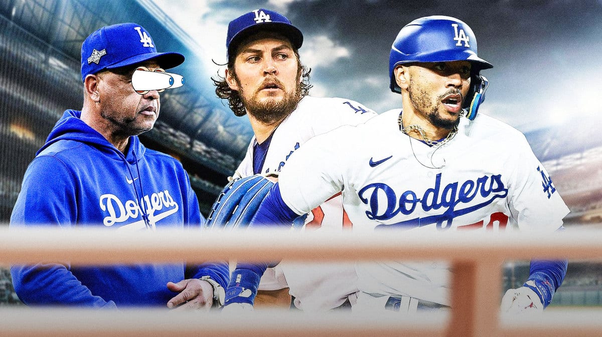 Los Angeles Dodgers manager Dave Roberts looking at Trevor Bauer and Mookie Betts