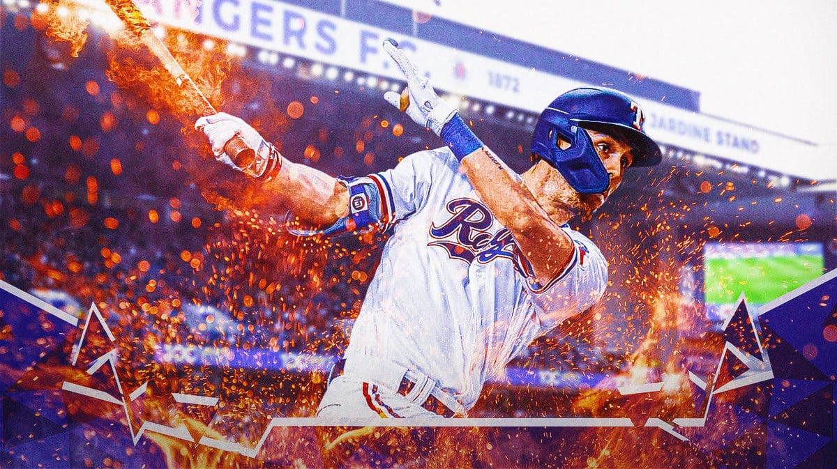 Action shot of Evan Carter of the Rangers with his bat on fire