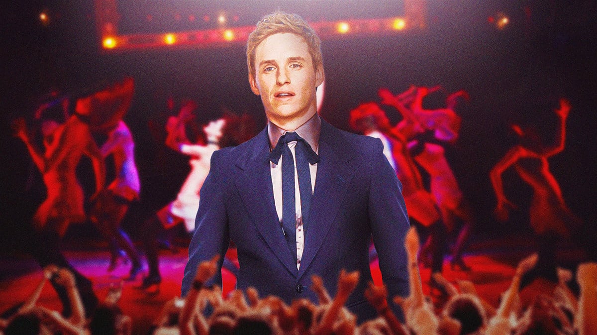 Eddie Redmayne with a scene from Cabaret behind him.