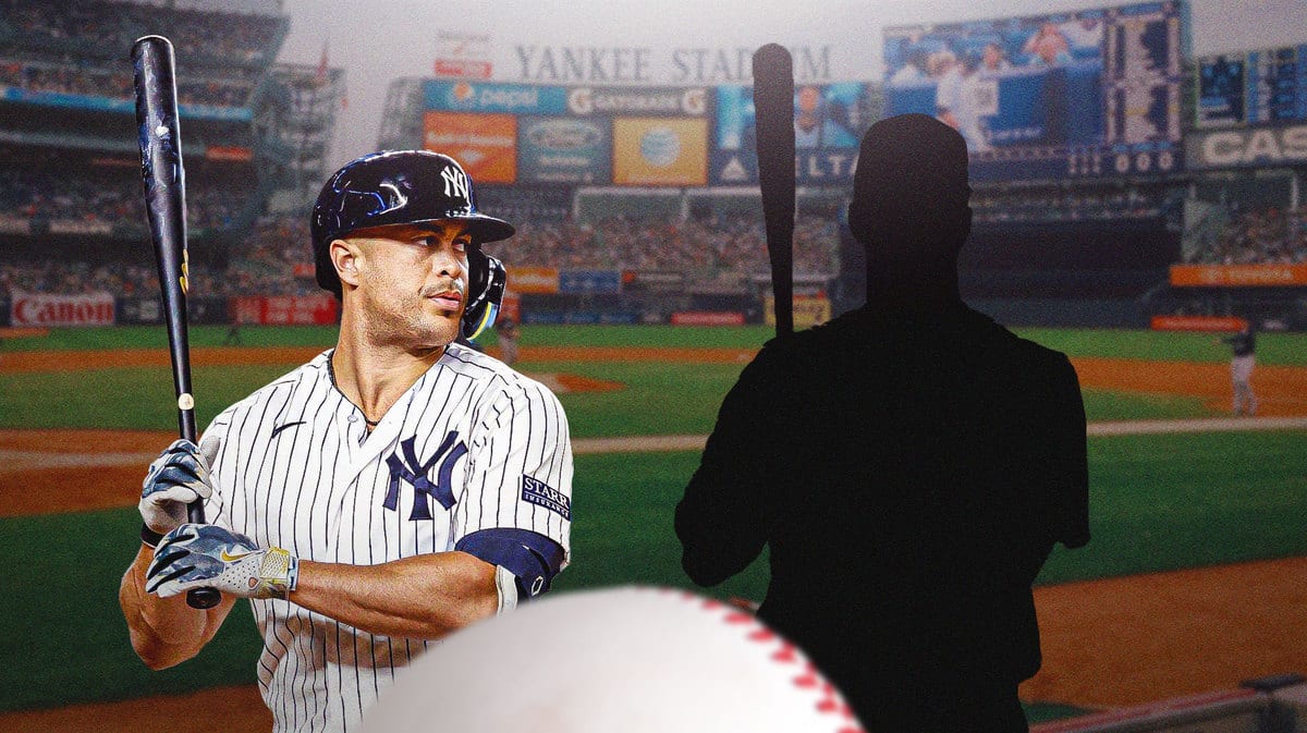 Giancarlo Stanton with Erik Kratz as a silhouette next to him.