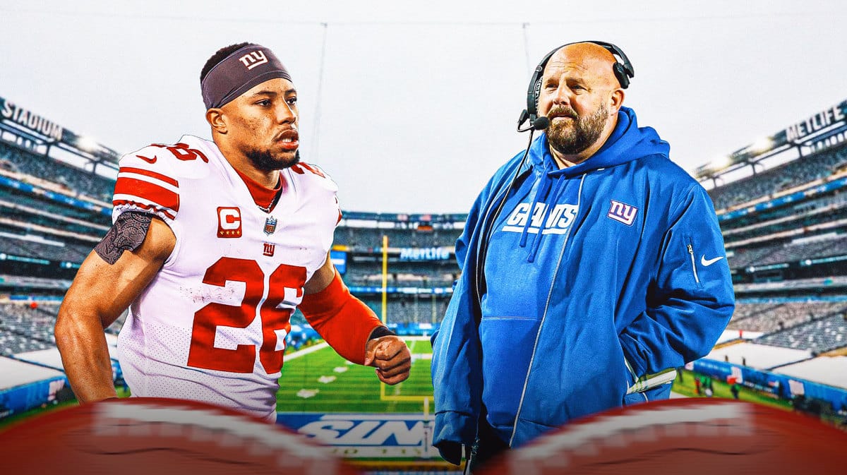 Giants running back Saquon Barkley and head coach Brian Daboll. Giants Stadium in the background.