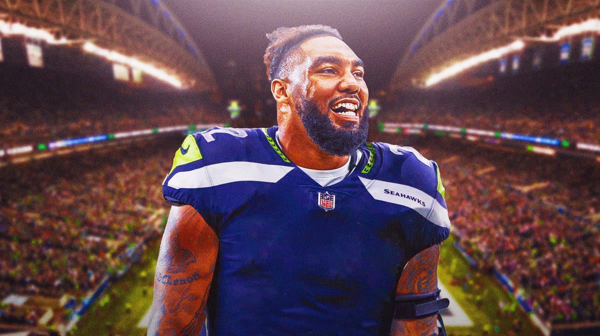 Leonard Williams in a Seahawks jersey in front of Seattle's stadium