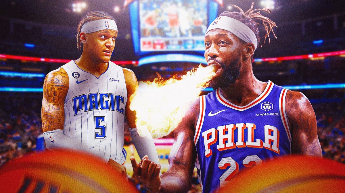 Patrick Beverley breathing fire on Magic Paolo Banchero. Background is Amway Center