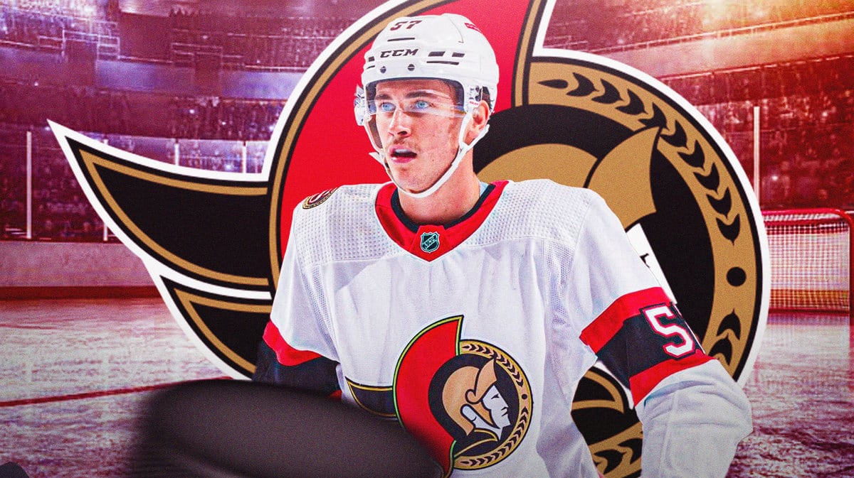 Image: Shane Pinto in middle of image looking stern, OTT Senators logo, hockey rink in background