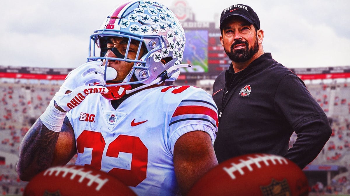 TreVeyon Henderson looking excited with Ryan Day in the background