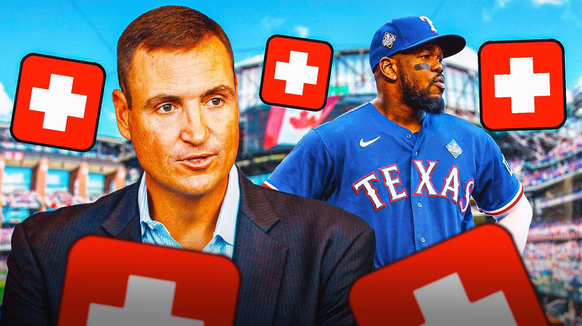 Rangers' GM Chris Young looking serious. Rangers' Adolis Garcia looking serious. Place a medical/injury symbol in image
