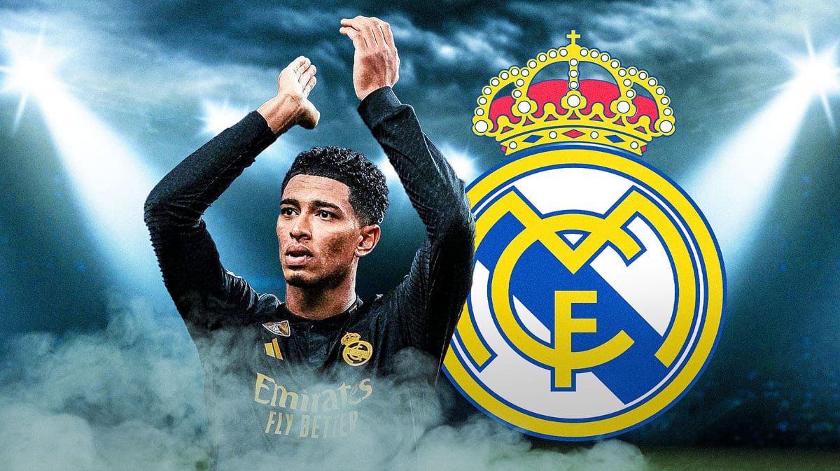 Jude Bellingham in front of the Real Madrid logo